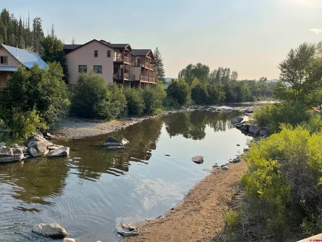 a view of a lake with a building in the background