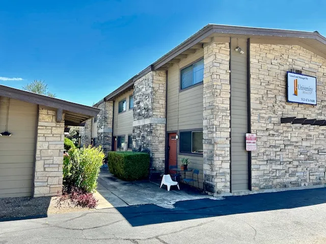 a front view of a house with garden