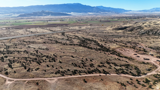 2600 Sevier Valley Canal Road Richfield, UT 84701 - Photo 38 of 63 Aerial view of property's location with a mountainous background and rural landscape