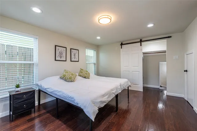 a bed room with a bed and a table