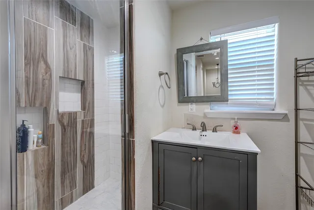 a bathroom with a sink and a mirror