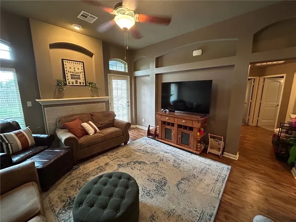 a living room with furniture and a flat screen tv