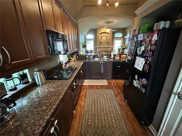 a kitchen with granite countertop lots of counter top space