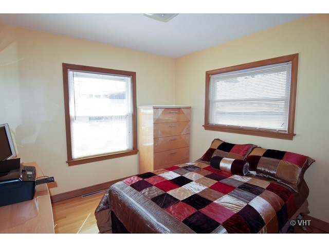575 Byrd Road Riverside, IL 60546 - Photo 6 of 9 a bedroom with a bed and a window