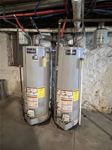 a view of a storage room with water heater and racks
