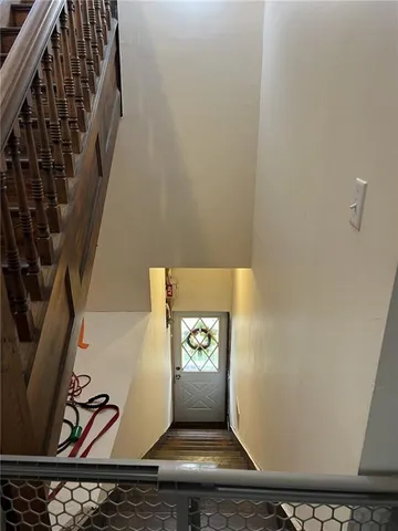 a view of an entryway with wooden floor
