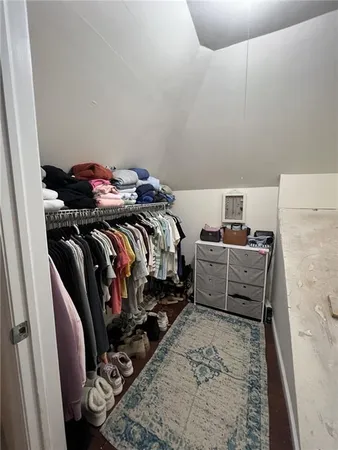 a bedroom with bed and a couch