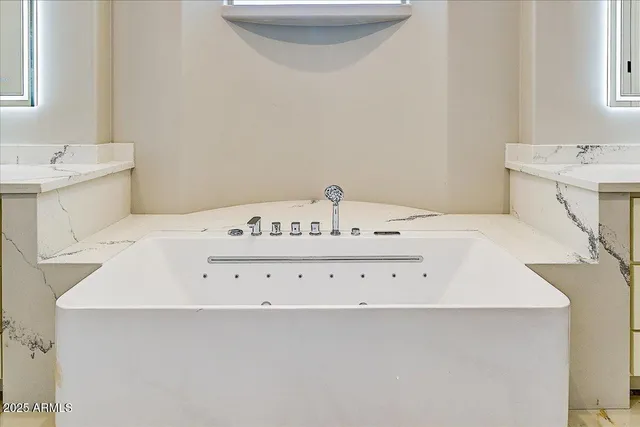 a bath tub sitting in a bathroom