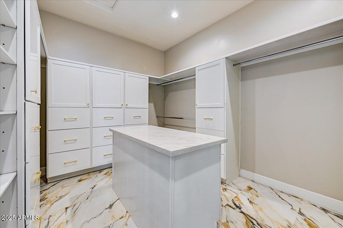 27730 North 35th Avenue Phoenix, AZ 85083 - Photo 14 of 37 a kitchen with white cabinets and a stove top oven