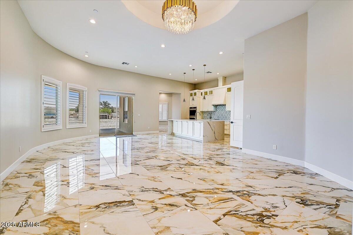 27730 North 35th Avenue Phoenix, AZ 85083 - Photo 19 of 37 a view of a livingroom with wooden floor and kitchen space