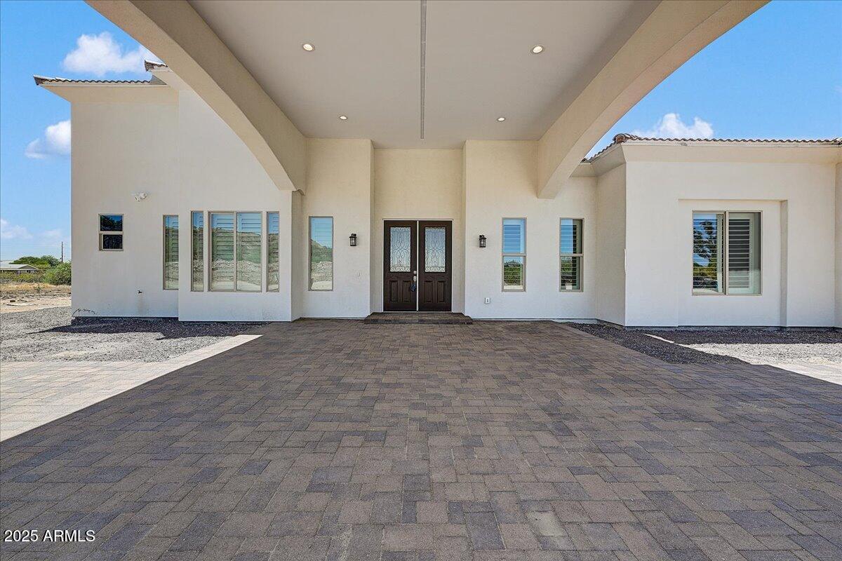 27730 North 35th Avenue Phoenix, AZ 85083 - Photo 2 of 37 a view of an empty room with wooden floor and a kitchen