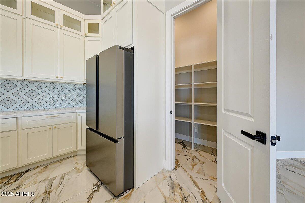 27730 North 35th Avenue Phoenix, AZ 85083 - Photo 21 of 37 a kitchen with a refrigerator and cabinets