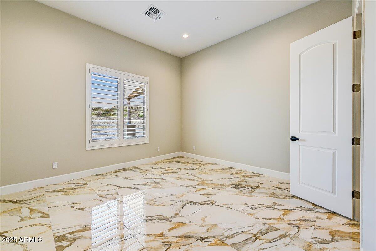 27730 North 35th Avenue Phoenix, AZ 85083 - Photo 25 of 37 a bedroom with a bed and a window
