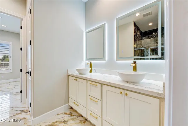 a bathroom with a sink and a mirror