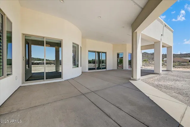 a front view of a building with a yard