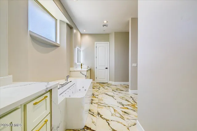 a bathroom with a sink a vanity and a mirror