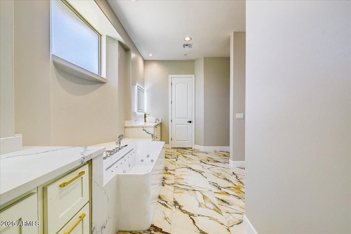 27730 North 35th Avenue Phoenix, AZ 85083 - Photo 10 of 37 a bathroom with a sink a vanity and a mirror