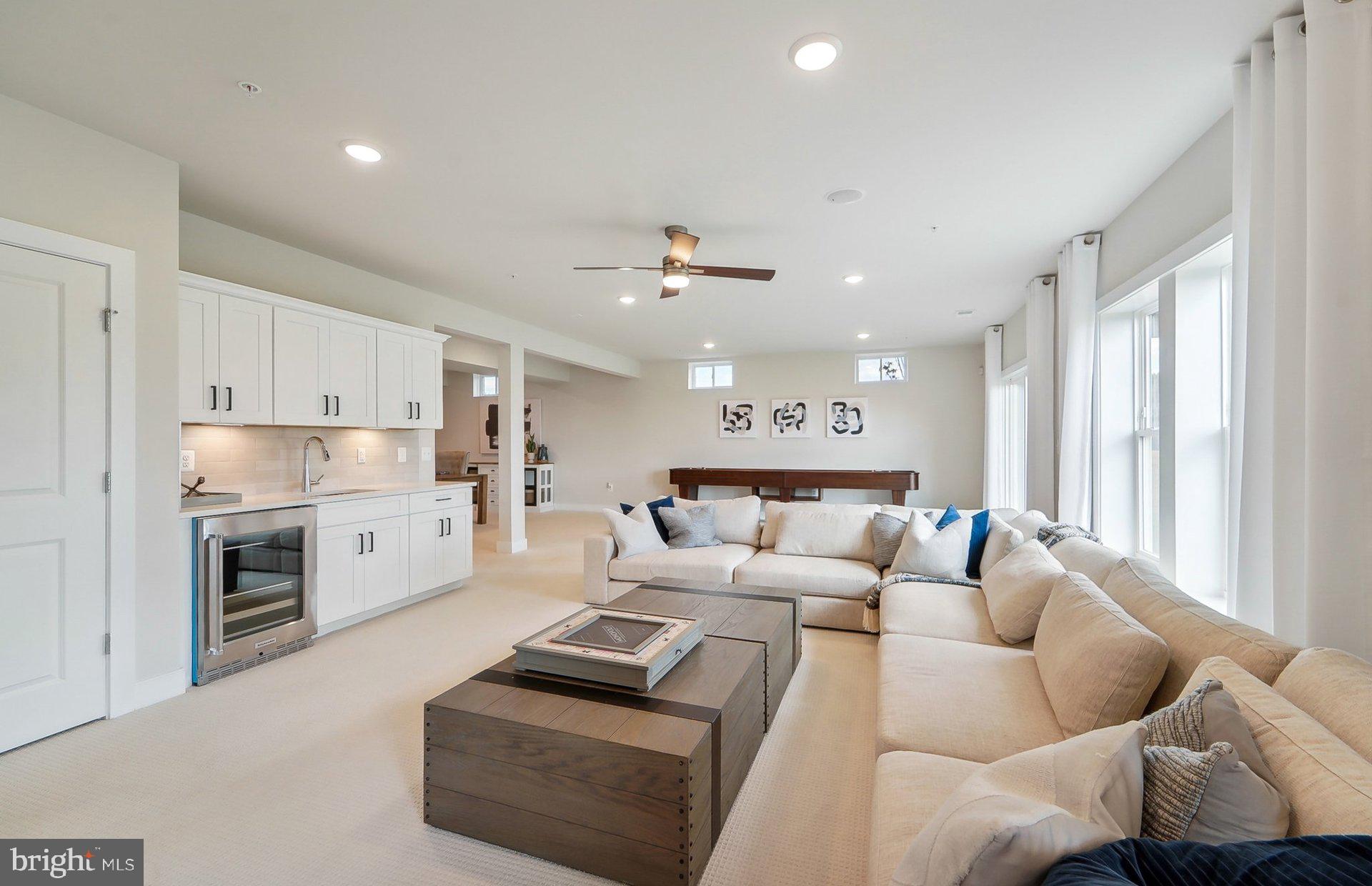 14402 Dowitcher Way Boyds, MD 20841 - Photo 39 of 52 a living room with furniture white walls and white walls