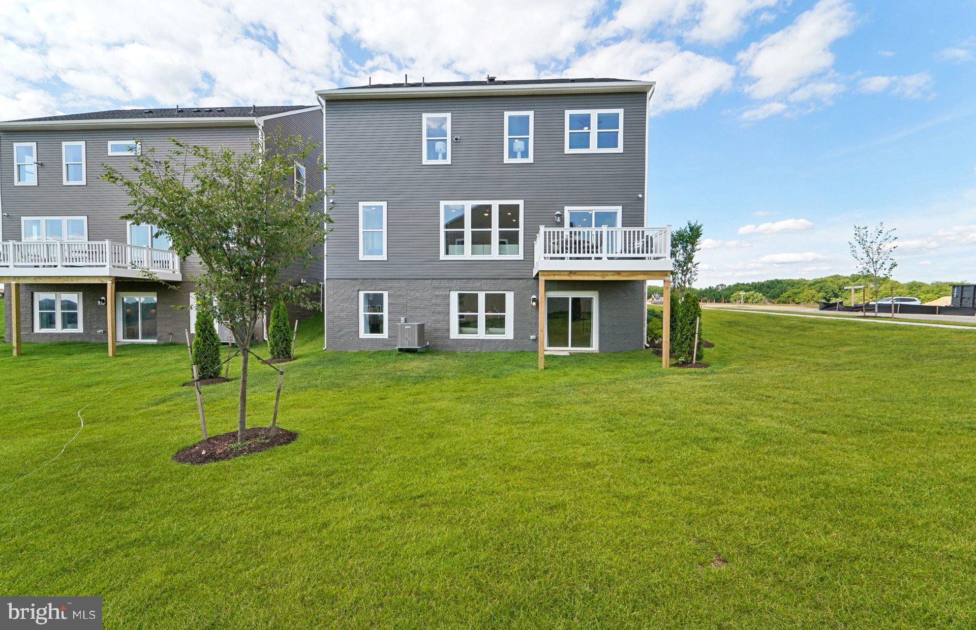 14402 Dowitcher Way Boyds, MD 20841 - Photo 50 of 52 a front view of a house with a yard