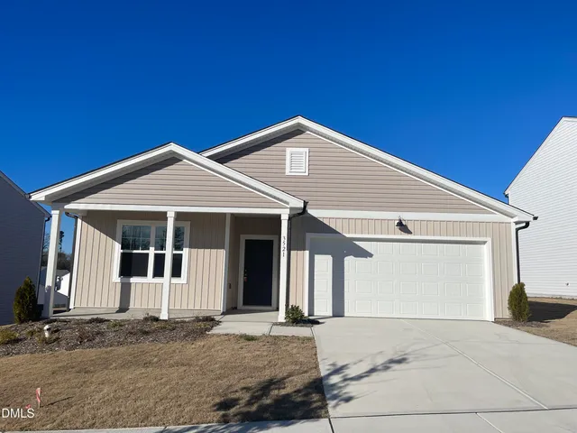 a front view of a house with a garage