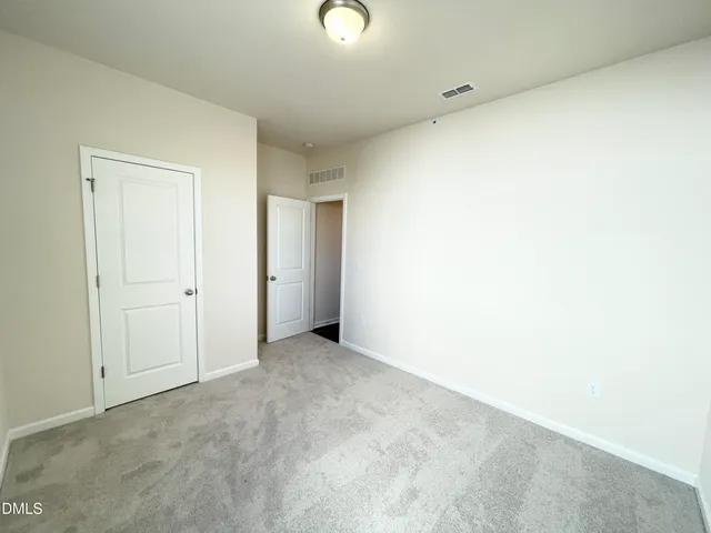 a kitchen with stainless steel appliances granite countertop a stove and a wooden floors