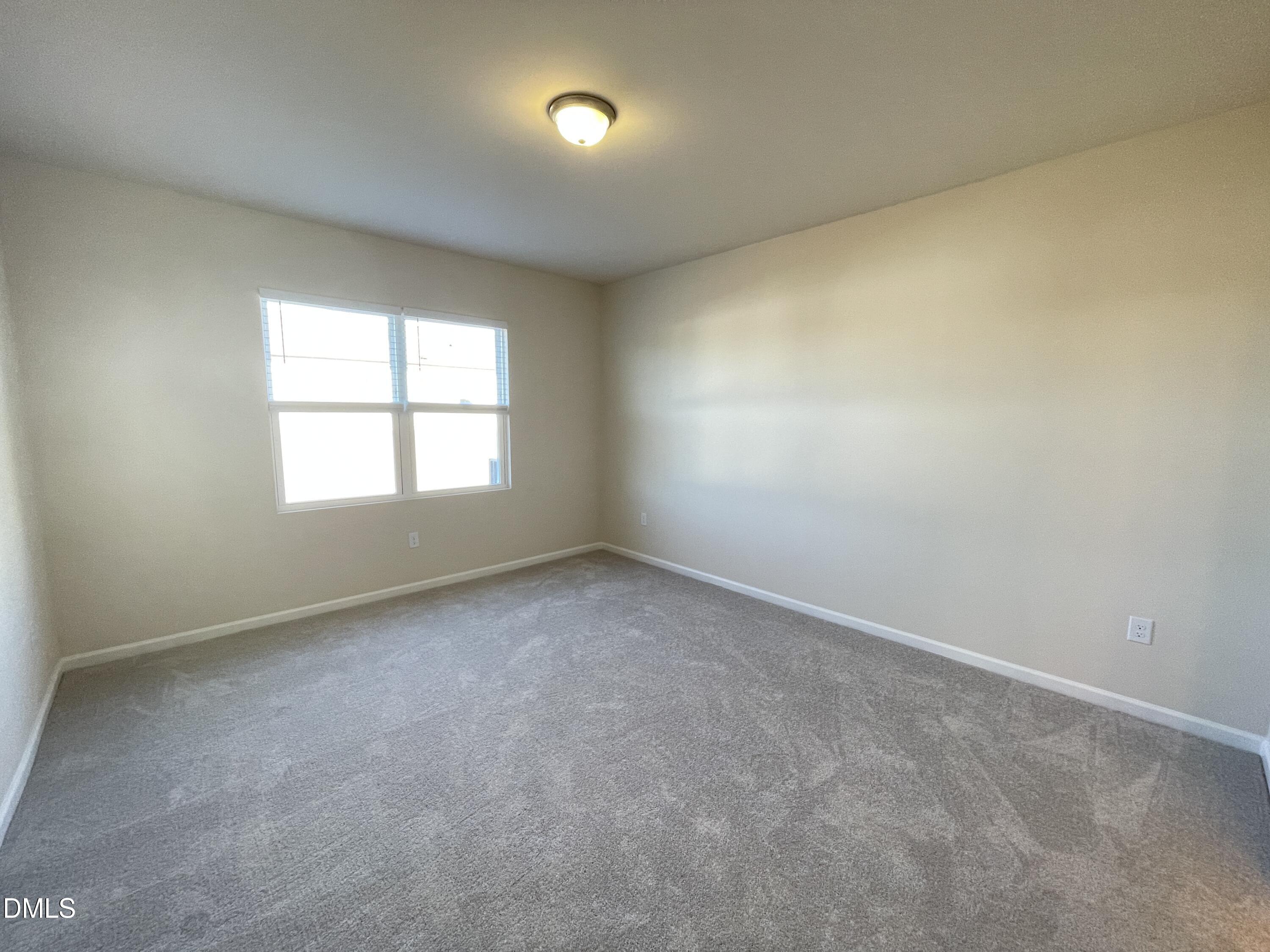 3521 New Town Road Raleigh, NC 27604 - Photo 17 of 24 an empty room with a window