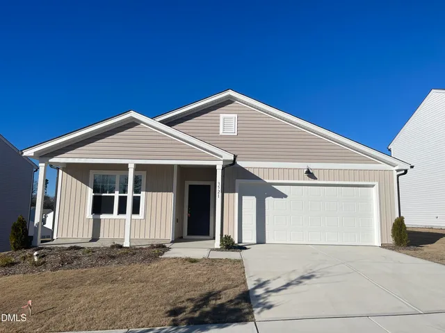 a front view of a house with a garage