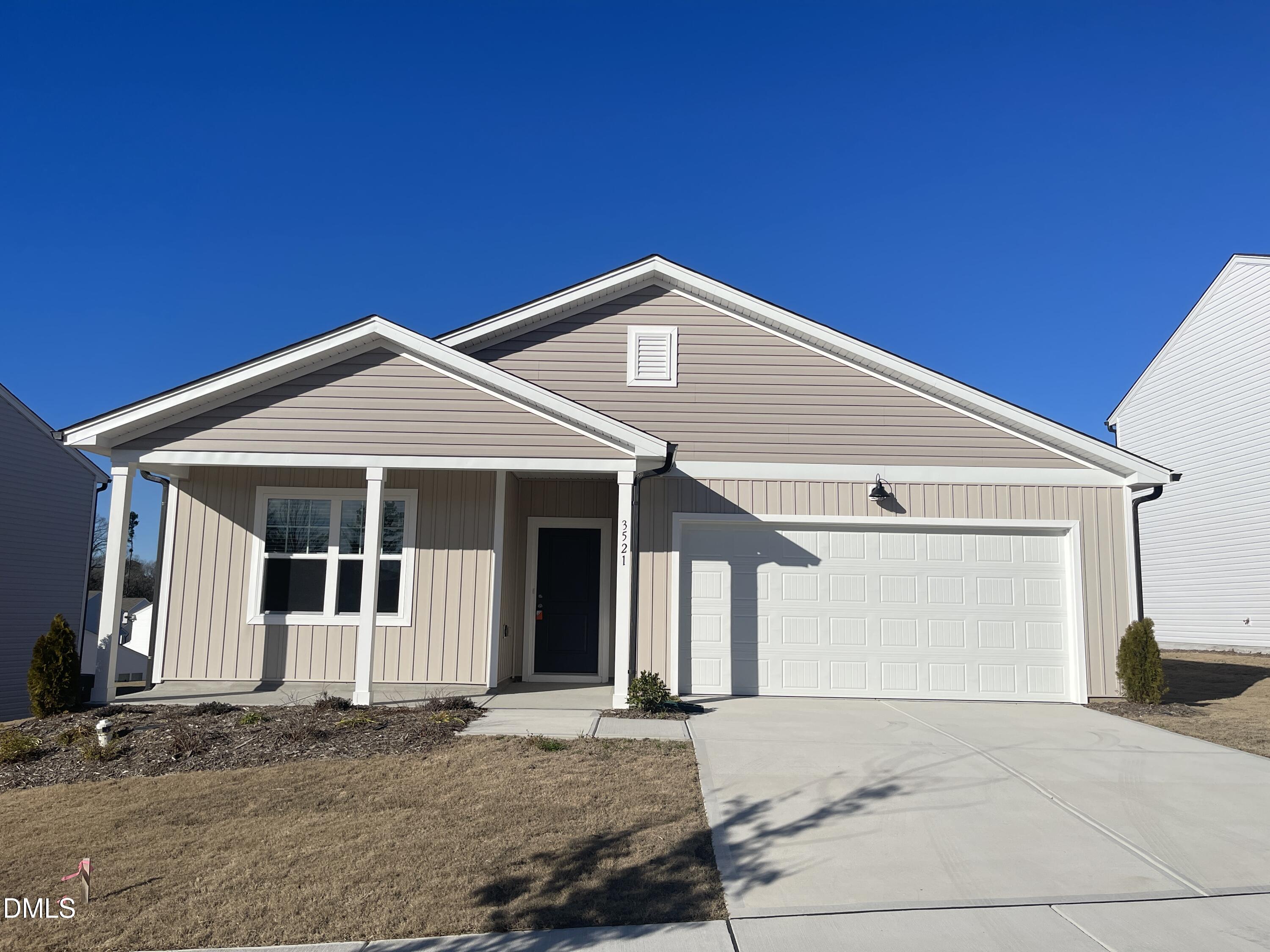 3521 New Town Road Raleigh, NC 27604 - Photo 2 of 24 a front view of a house with a garage