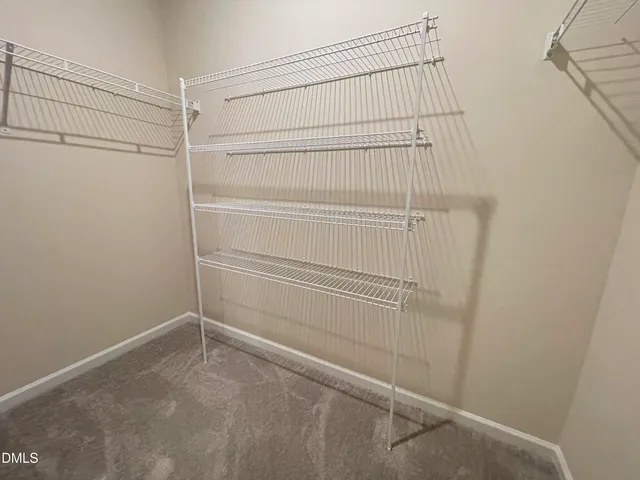 a view of kitchen with wooden floor and electronic appliances