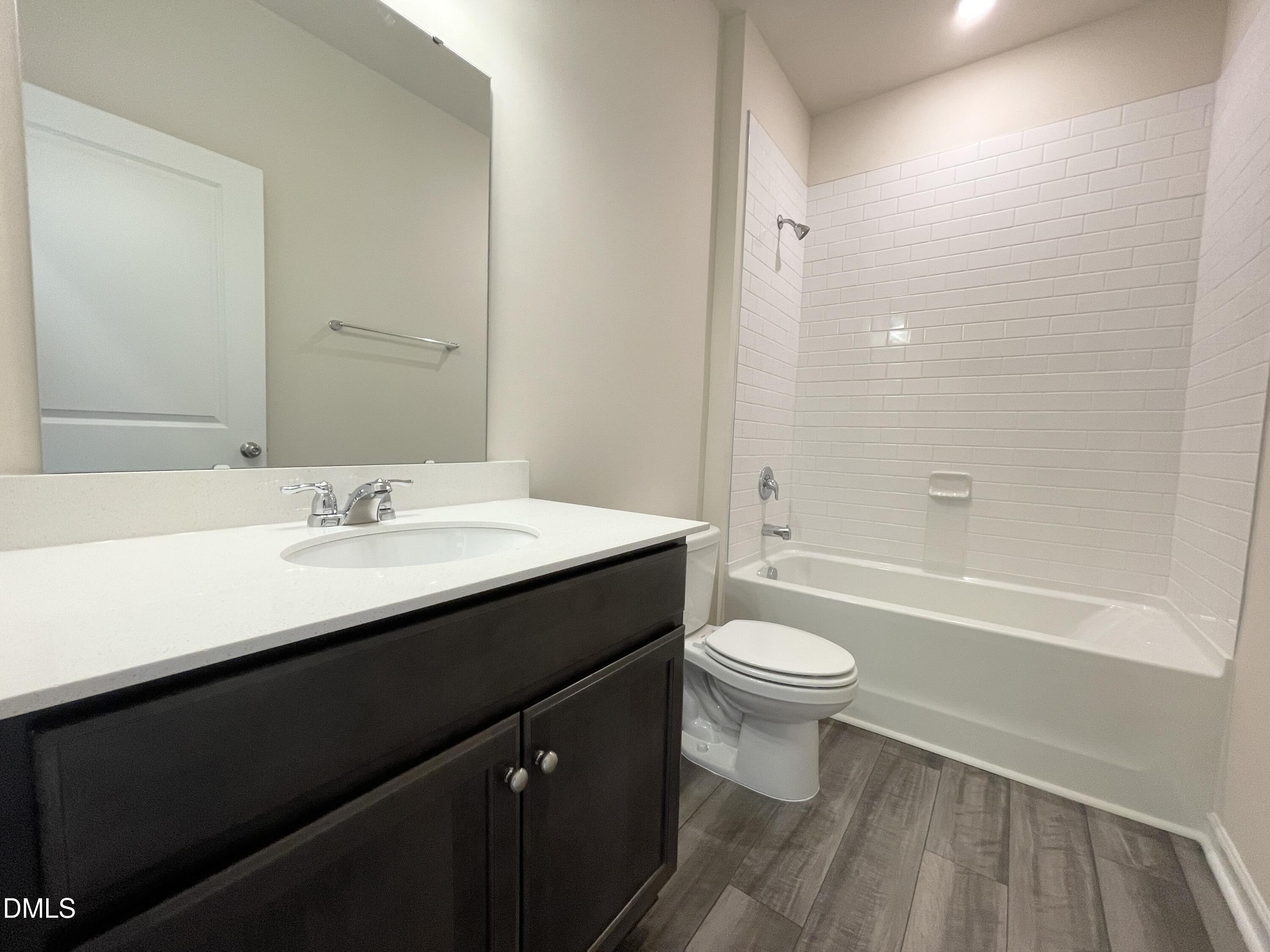 3521 New Town Road Raleigh, NC 27604 - Photo 22 of 29 a bathroom with a sink a toilet and shower