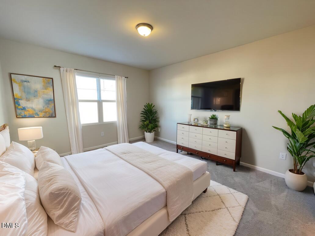 3521 New Town Road Raleigh, NC 27604 - Photo 3 of 29 a bedroom with a bed and a flat screen tv