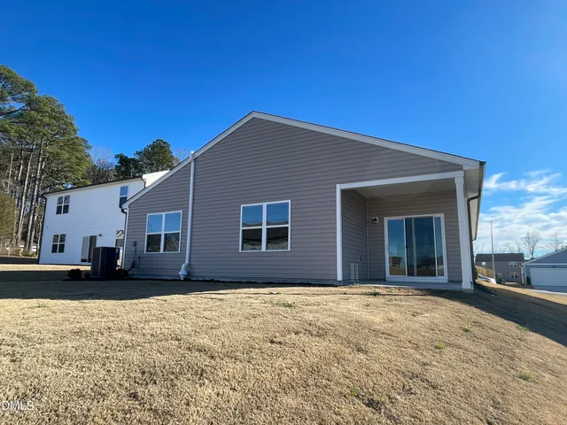 a view of a swimming pool and an outdoor seating