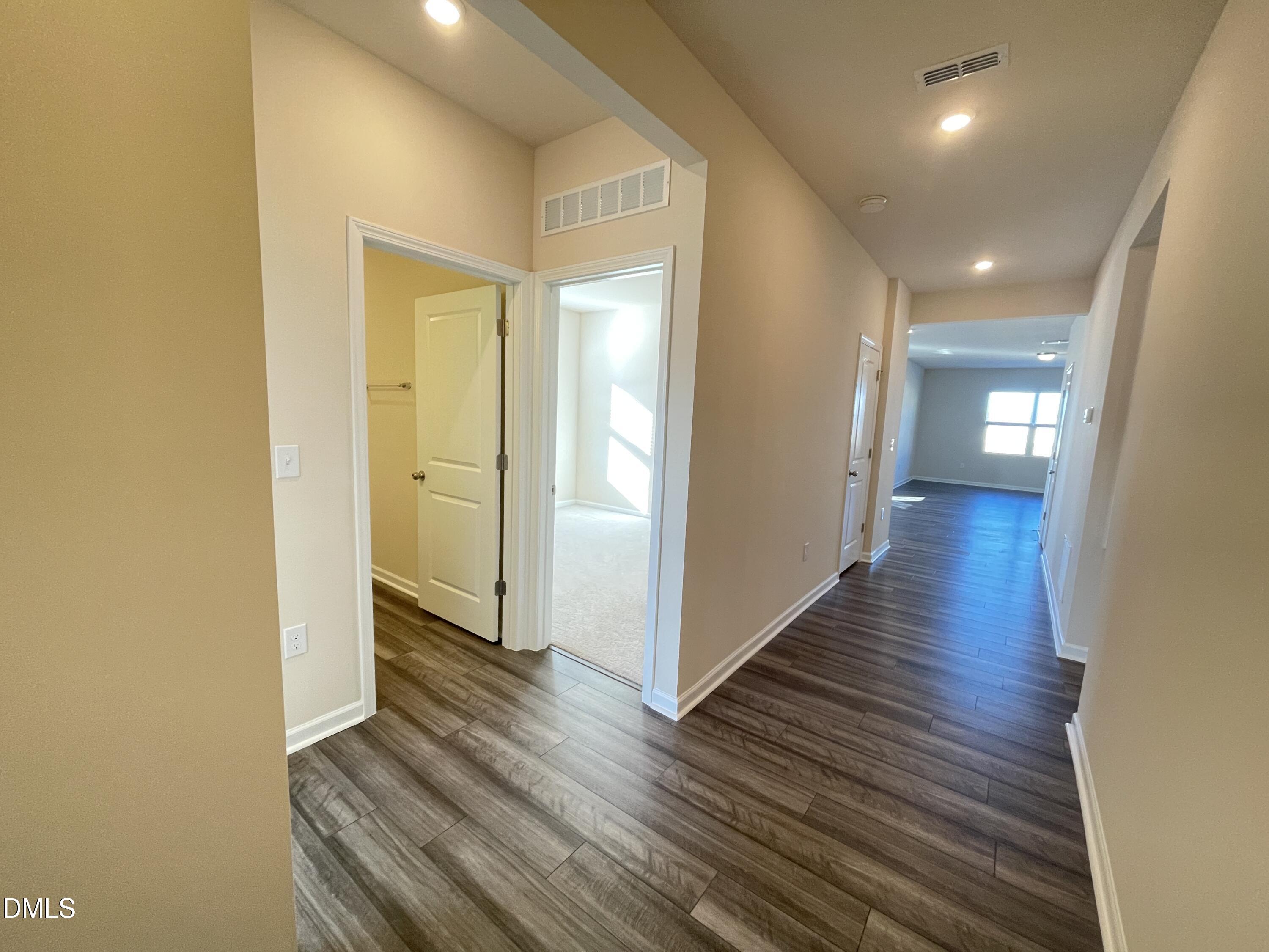3521 New Town Road Raleigh, NC 27604 - Photo 6 of 24 a view of a hallway with wooden floor