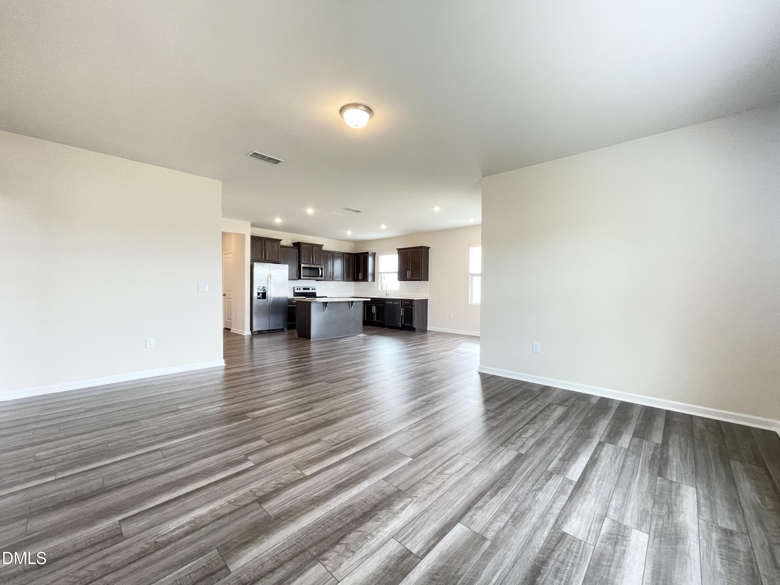3521 New Town Road Raleigh, NC 27604 - Photo 6 of 29 a view of kitchen and hall with wooden floor