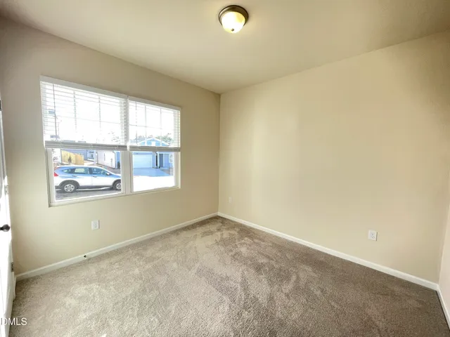 a view of empty room with windows