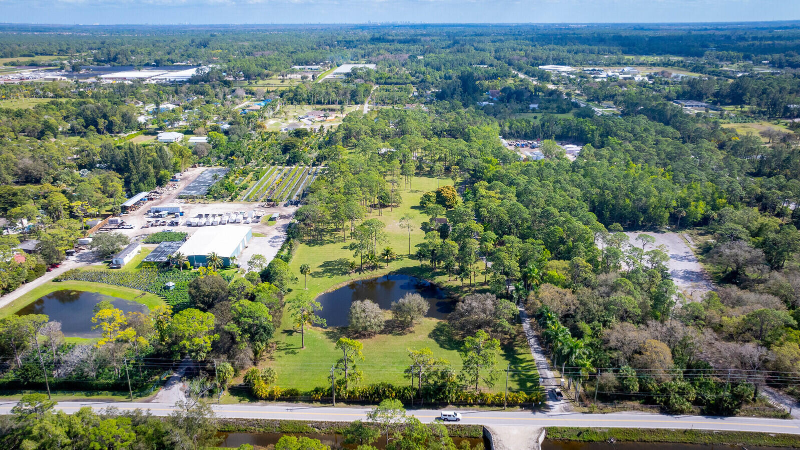 2150-2140 C Road Loxahatchee Groves, FL 33470 - Photo 2 of 14 an aerial view of residential house with outdoor space
