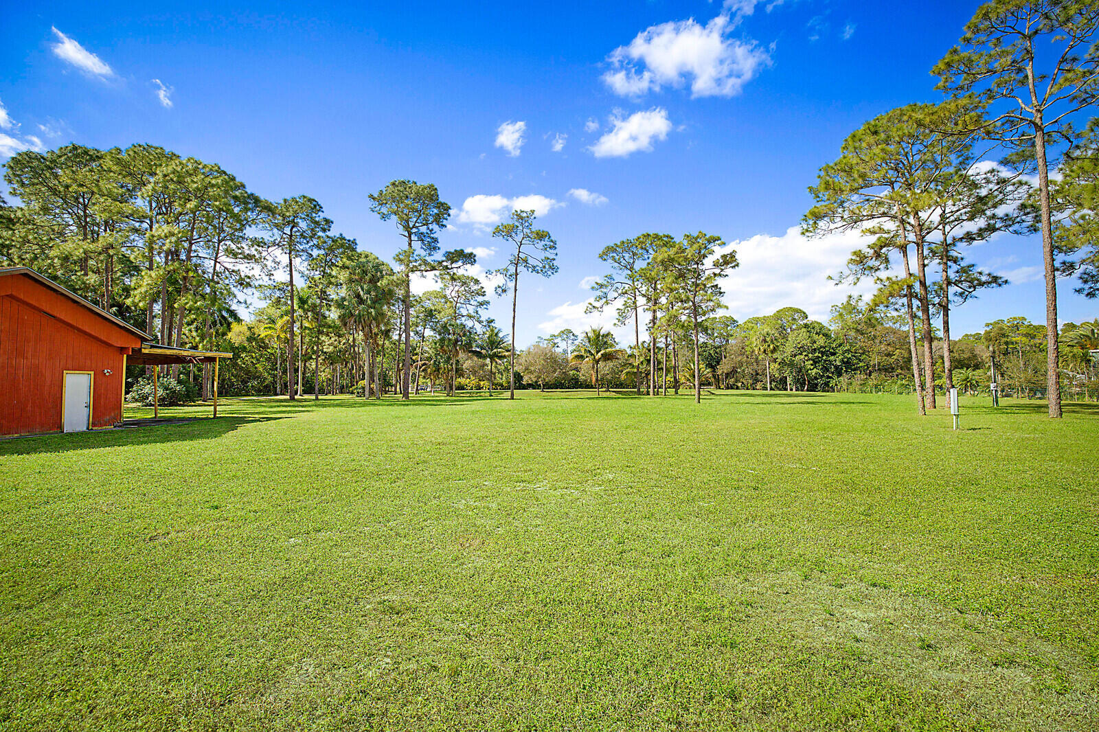 2150-2140 C Road Loxahatchee Groves, FL 33470 - Photo 6 of 14 a view of a house with a big yard