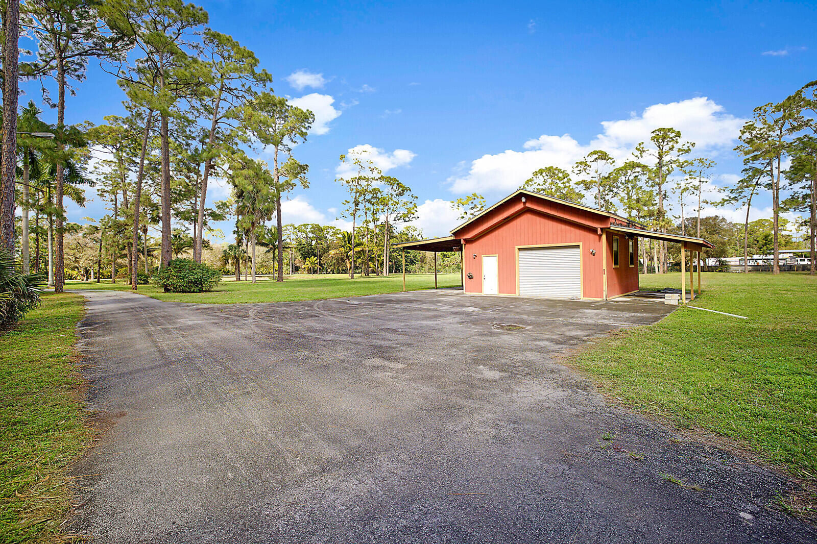 2150-2140 C Road Loxahatchee Groves, FL 33470 - Photo 7 of 14 a view of a house with a yard