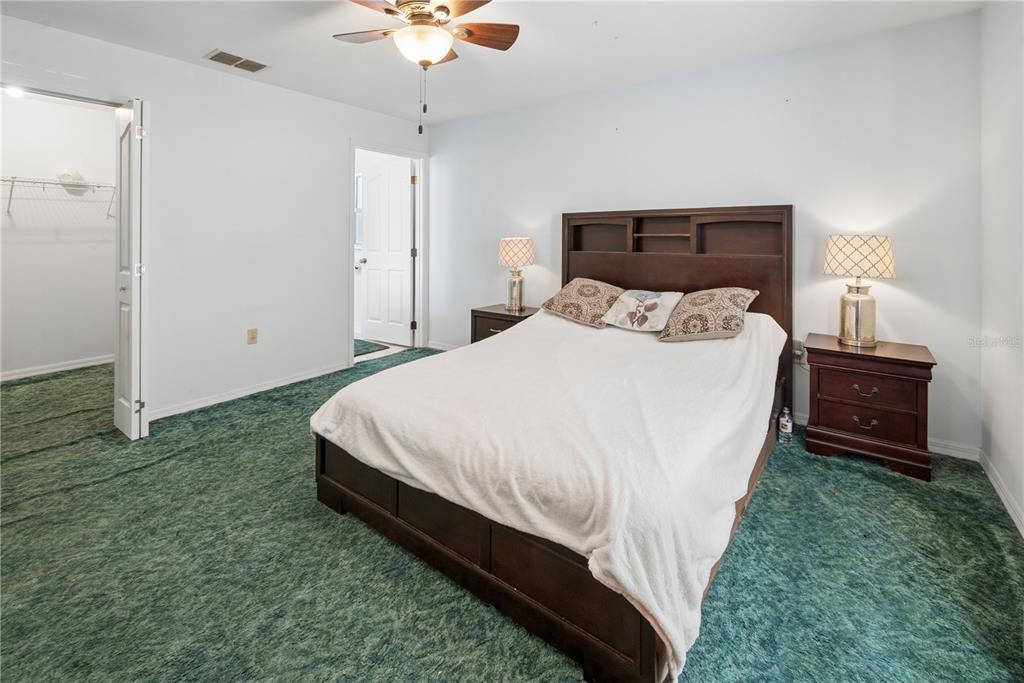1750 Southwest 15th Street Bell, FL 32619 - Photo 13 of 34 a bed room with a bed and a night stand