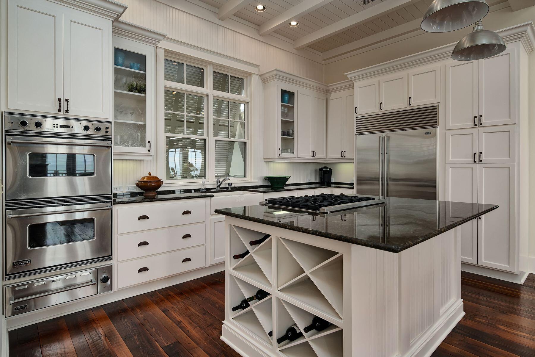 244 West Bermuda Drive Santa Rosa Beach, FL 32459 - Photo 11 of 66 a kitchen with granite countertop a stove and a sink