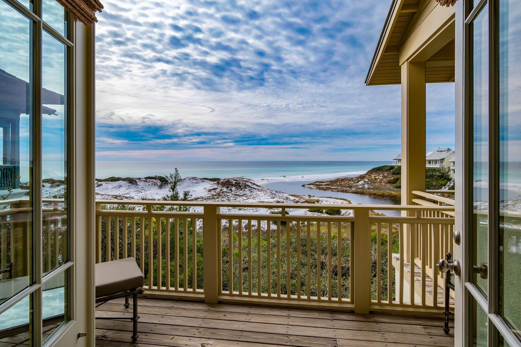 244 West Bermuda Drive Santa Rosa Beach, FL 32459 - Photo 17 of 66 a view of a balcony with chair and wooden floor