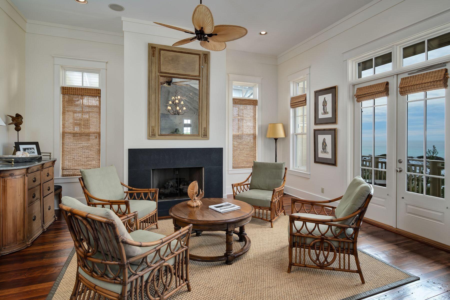 244 West Bermuda Drive Santa Rosa Beach, FL 32459 - Photo 22 of 66 a dining room with furniture a fireplace and wooden floor