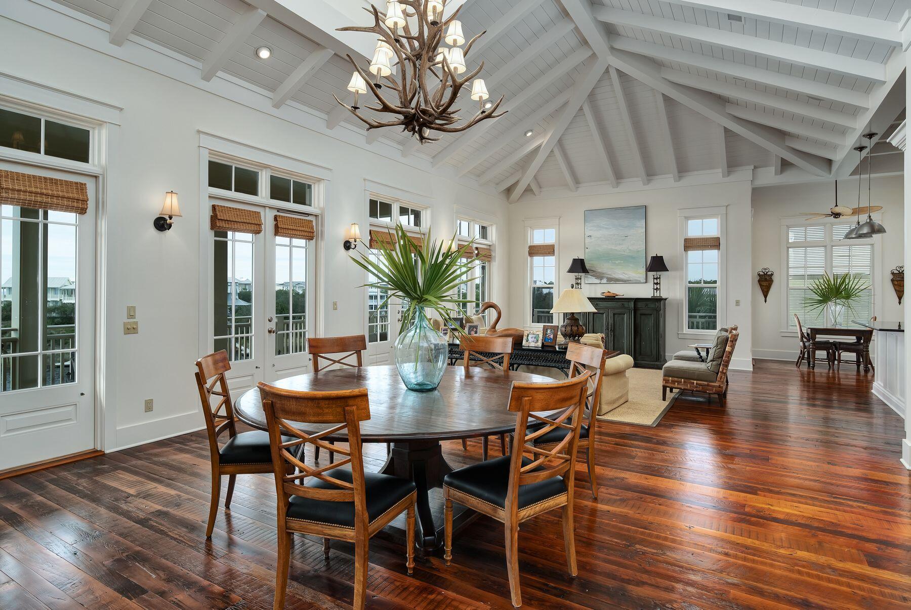 244 West Bermuda Drive Santa Rosa Beach, FL 32459 - Photo 26 of 66 a view of a dining room with furniture window and wooden floor