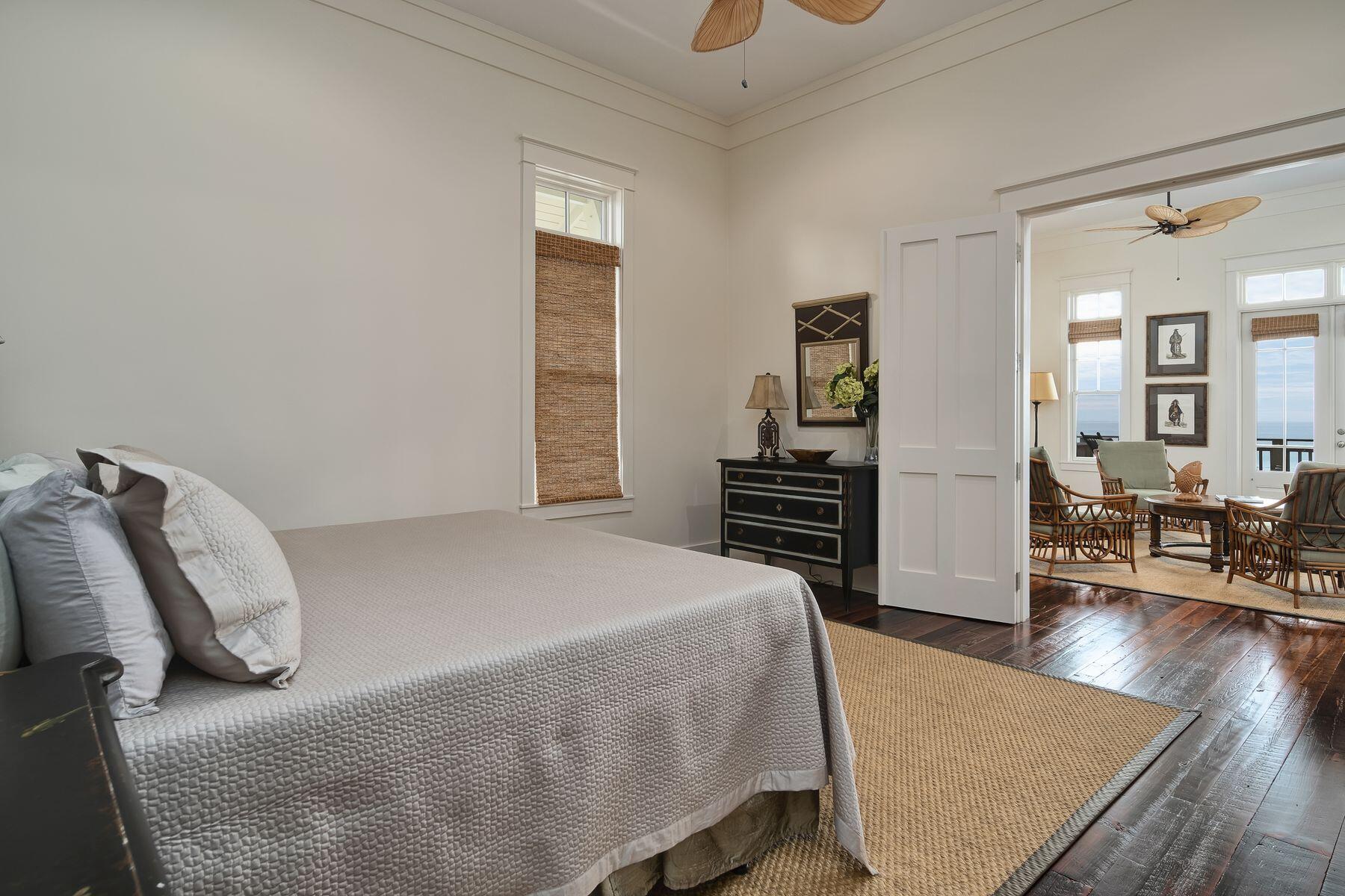 244 West Bermuda Drive Santa Rosa Beach, FL 32459 - Photo 28 of 66 a bedroom with a bed and wooden floor