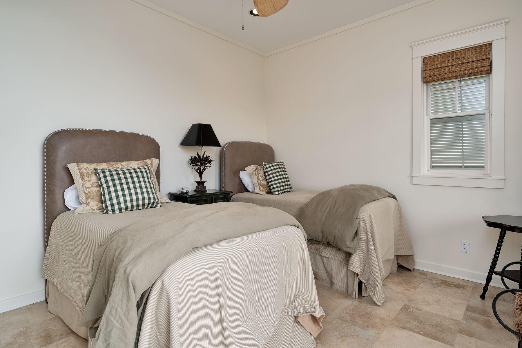 244 West Bermuda Drive Santa Rosa Beach, FL 32459 - Photo 33 of 66 a bedroom with two beds and a chair