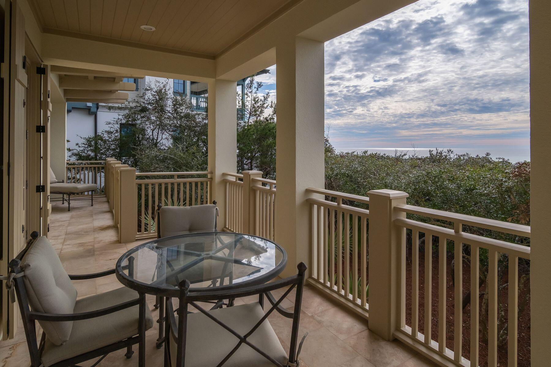 244 West Bermuda Drive Santa Rosa Beach, FL 32459 - Photo 41 of 66 a view of a balcony with a table and chairs