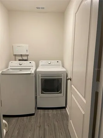 a utility room with dryer and washer