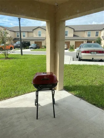a front view of a house with garden and outdoor seating