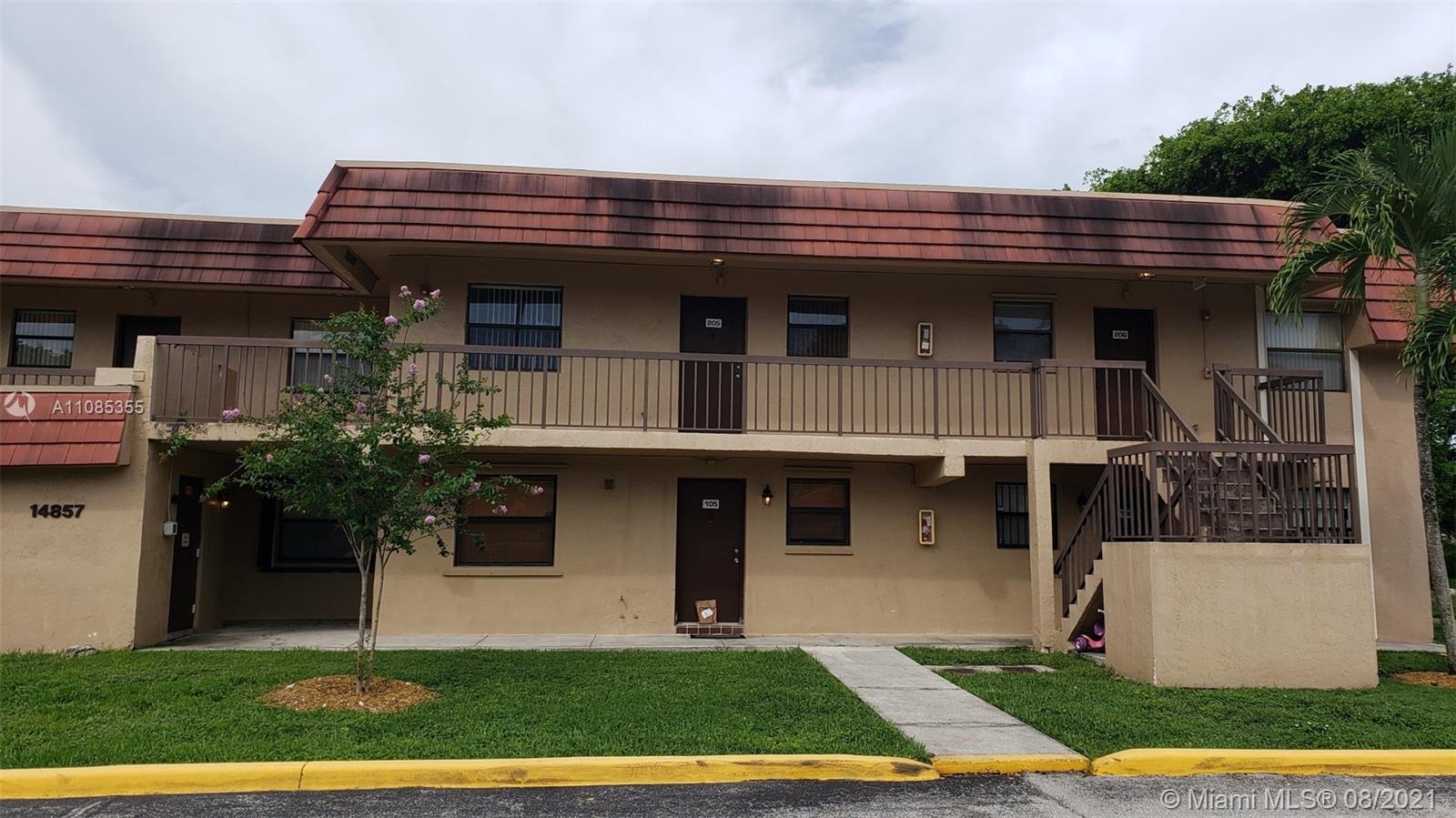 14857 Southwest 104th Street, Unit 9205 Miami, FL 33196 - Photo 1 of 11 a view of house with yard and outdoor seating
