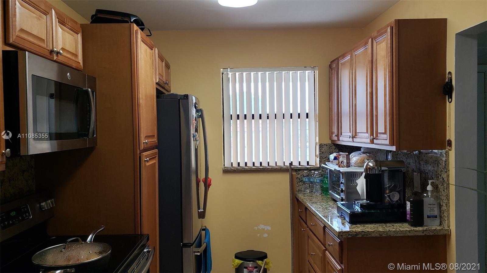 14857 Southwest 104th Street, Unit 9205 Miami, FL 33196 - Photo 5 of 11 a bathroom with a sink and a mirror